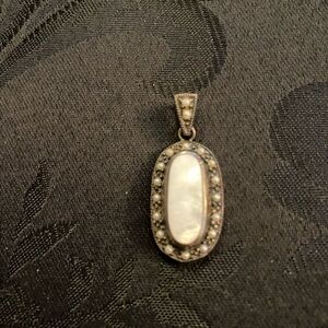 Elegant Sterling Silver Mother Of Pearl Center Stone With Smaller Pearls Pendant